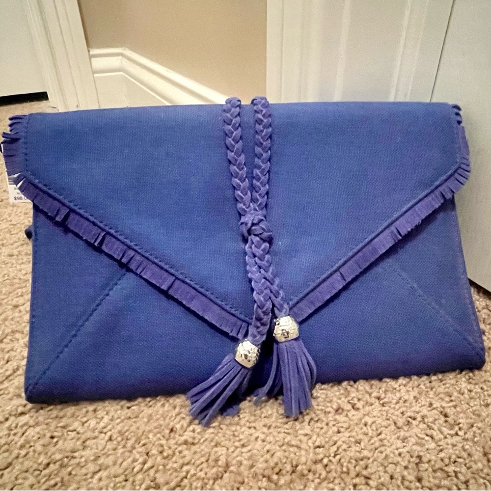 Bright blue NWT wristlet purse.